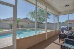 Jacksonville, Florida / USA - November 26 2019: Screened in patio with view of the pool