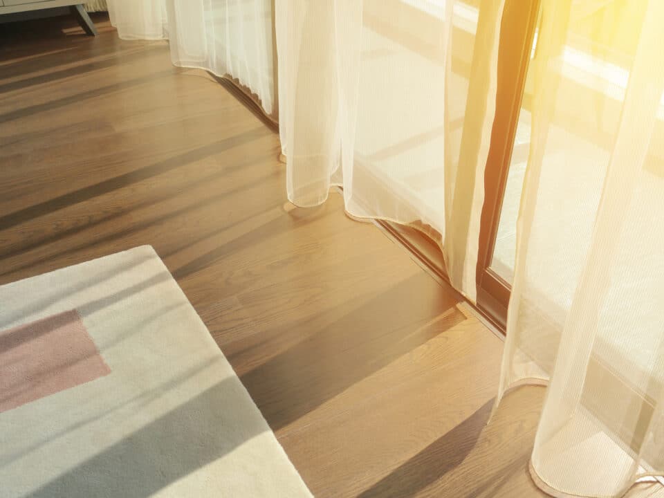 sunrise through transparent curtains of a window in the morning
