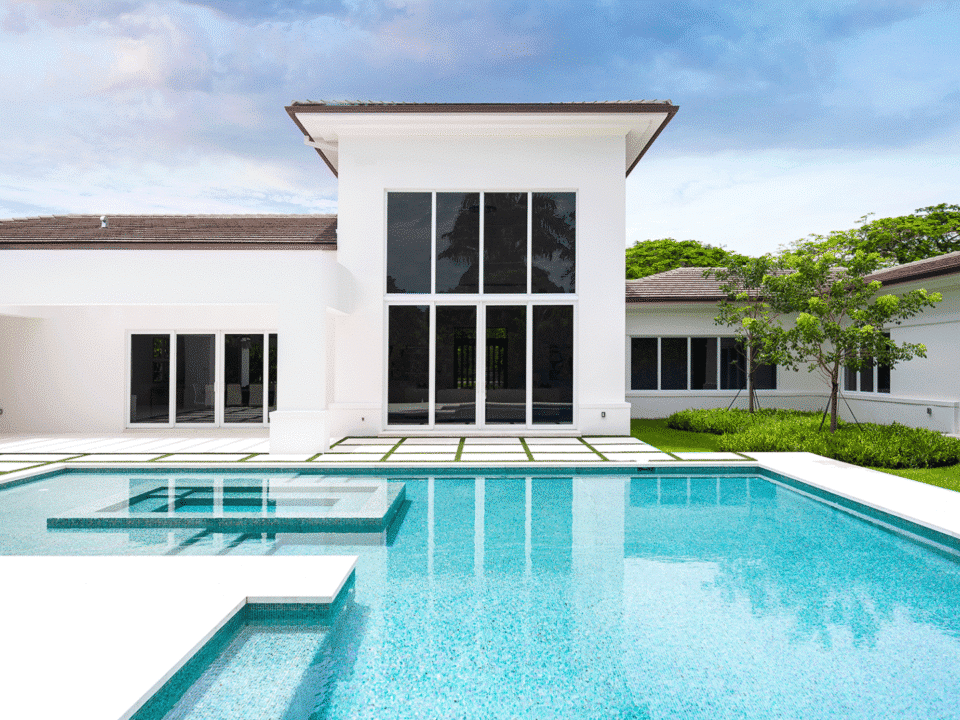 New patio doors for spring: Home exterior with outdoor pool.